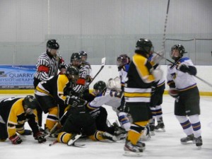 A male linesman was kicked and punched by players while he was laying on the ice during an Interlake bantam boysÕ minor hockey playoff game in Stonewall on Sunday afternoon. The game, which saw the Stonewall Blues win the league title with a 5-1 win over Lake Manitoba First Nation, was called by officials with 11 minutes remaining in the third period. There were four match penalties called in the game, prompting calls for stiffer sanctions to teams and players involved in the abuse officials.   Chris Gareau photo